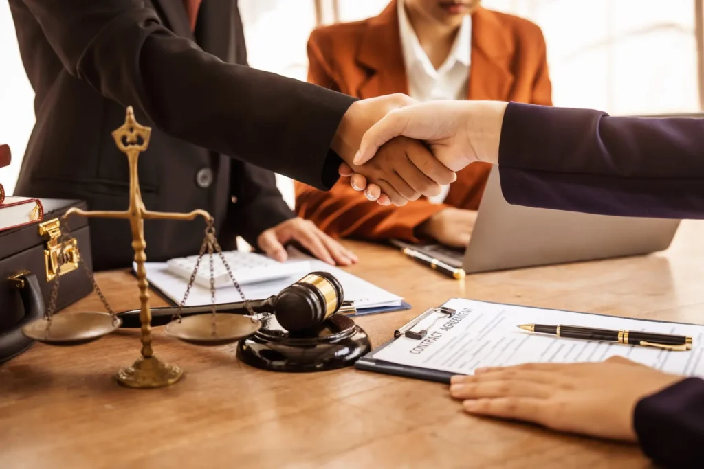 Lawyer shaking hands with client